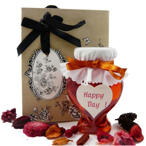 Petit sac en carton décoré de fleurs et ruban noir